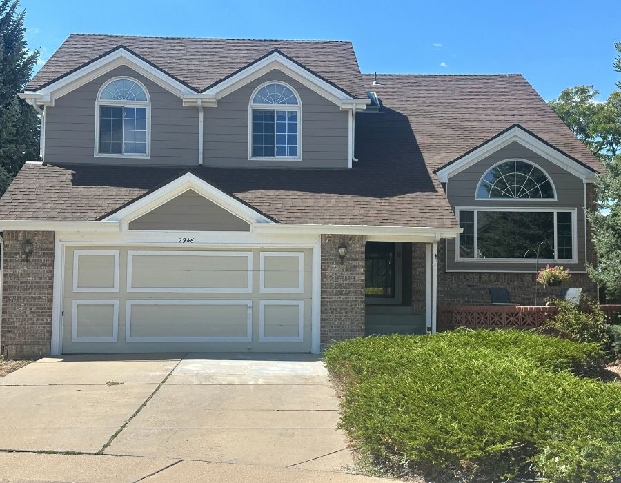 Image of a house with new paint and siding.